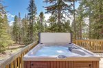 Hot tub on the front deck with table and chairs